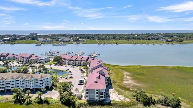 100 Mariners Cay Dr, Folly Beach, SC 29439 - drone / aerial view of a large body of water and apartment complex / building
