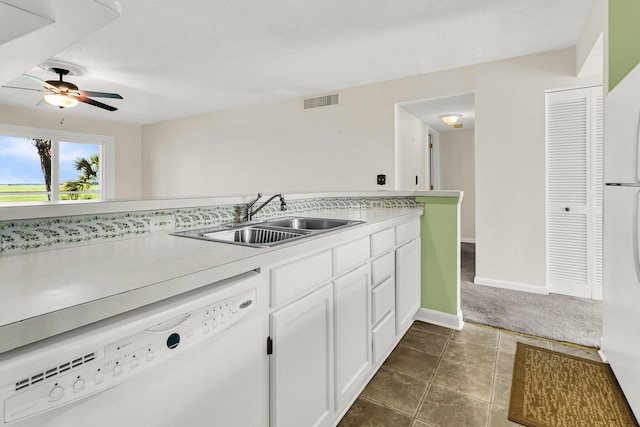 100 Mariners Cay Dr, Folly Beach, SC 29439 - kitchen with white appliances, a sink, ceiling fan, white cabinetry, and light countertops