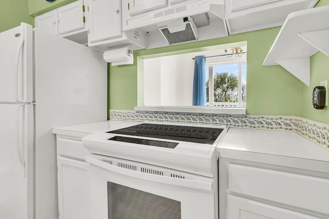 100 Mariners Cay Dr, Folly Beach, SC 29439 - kitchen featuring white appliances, light countertops, and white cabinets