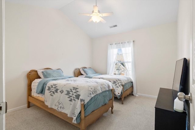 bedroom featuring visible vents, baseboards, carpet, vaulted ceiling, and a ceiling fan