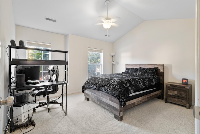 bedroom featuring visible vents, lofted ceiling, carpet floors, baseboards, and ceiling fan