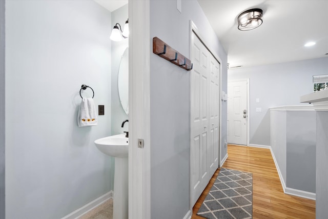 interior space with recessed lighting, baseboards, and wood finished floors