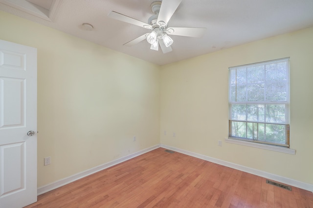 spare room with ceiling fan and light hardwood / wood-style floors