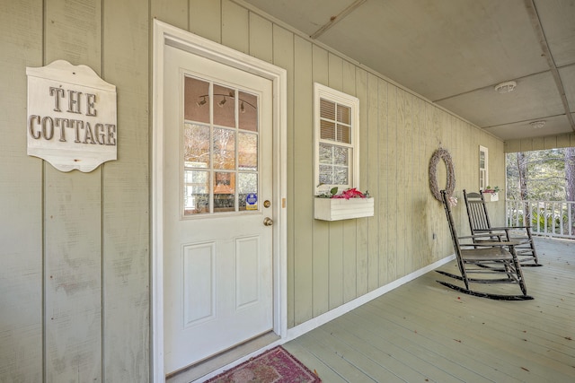 doorway to property with covered porch