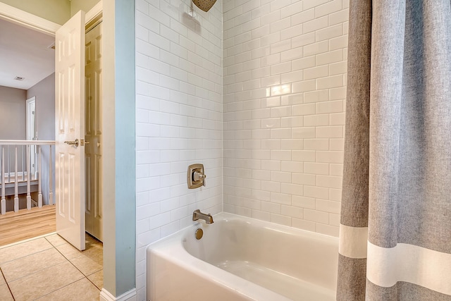 full bath featuring  shower combination and tile patterned flooring