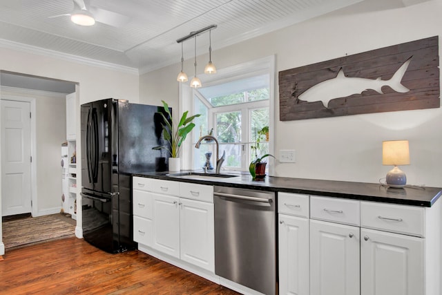 kitchen with stainless steel dishwasher, dark wood-type flooring, sink, ceiling fan, and white cabinets