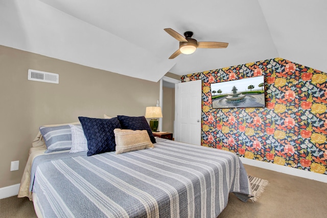 carpeted bedroom featuring ceiling fan and vaulted ceiling