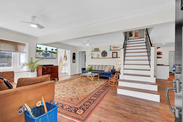 living room featuring ceiling fan and hardwood / wood-style floors