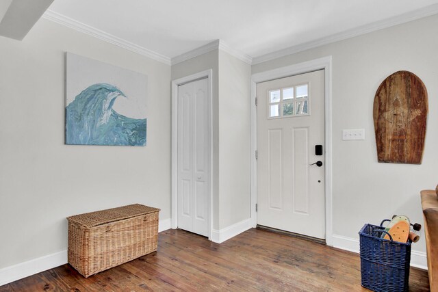 foyer with ornamental molding and hardwood / wood-style flooring