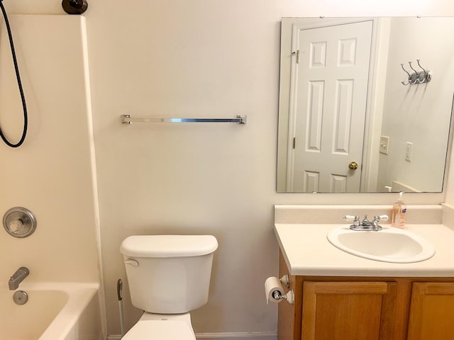 bathroom featuring toilet, vanity, and shower / bathtub combination