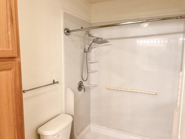 full bath featuring a shower and toilet