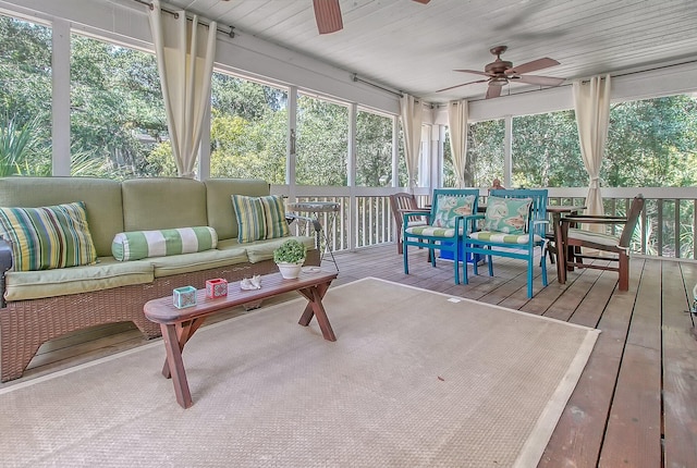 sunroom / solarium featuring wooden ceiling, plenty of natural light, and ceiling fan