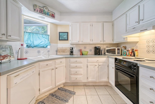 kitchen featuring under cabinet range hood, white cabinetry, white appliances, light countertops, and light tile patterned floors