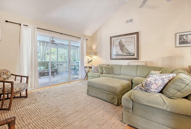 living room with visible vents, high vaulted ceiling, a ceiling fan, and wood finished floors