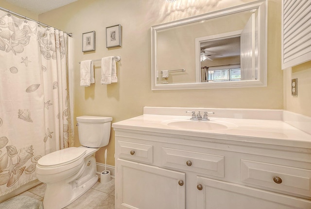 bathroom with baseboards, toilet, tile patterned floors, vanity, and a ceiling fan