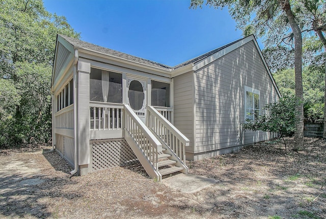 view of front of home with a sunroom