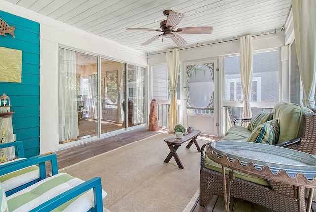 sunroom / solarium featuring wooden ceiling and ceiling fan