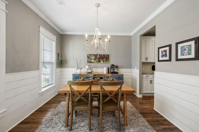 423 Sanctuary Park Dr, Summerville, SC 29486 - dining area with a chandelier, a wainscoted wall, crown molding, and dark wood finished floors