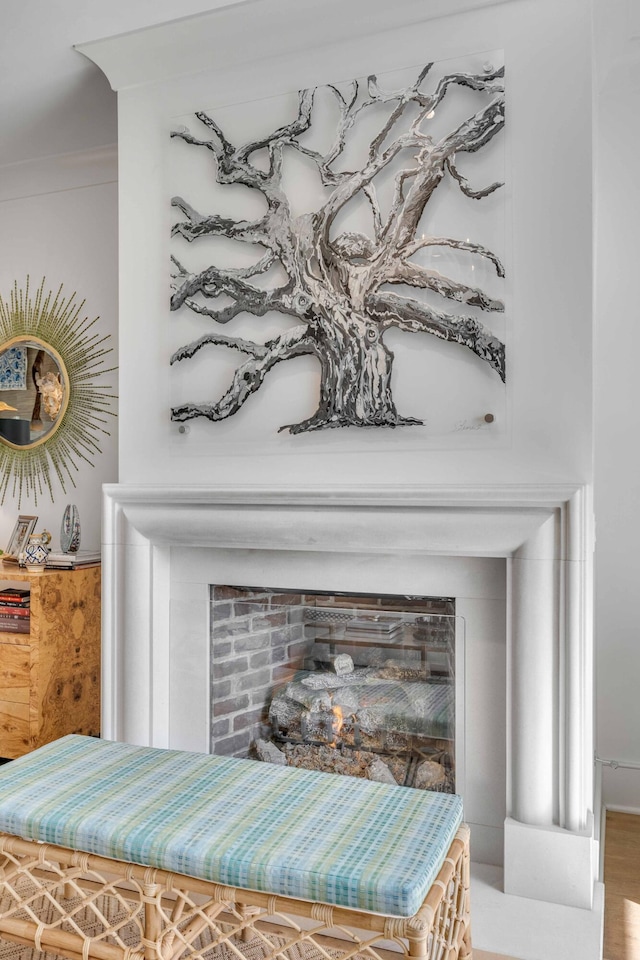 room details with hardwood / wood-style floors and crown molding