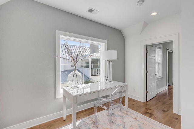 hall with hardwood / wood-style floors