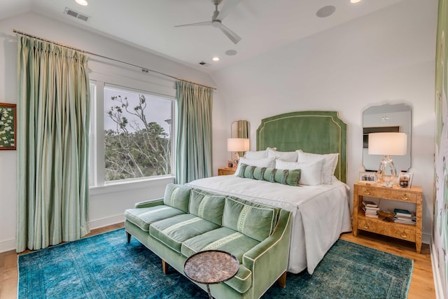 bedroom featuring vaulted ceiling, hardwood / wood-style floors, and ceiling fan