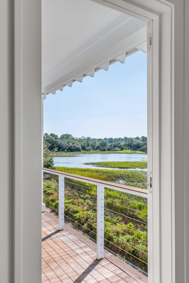 balcony featuring a water view