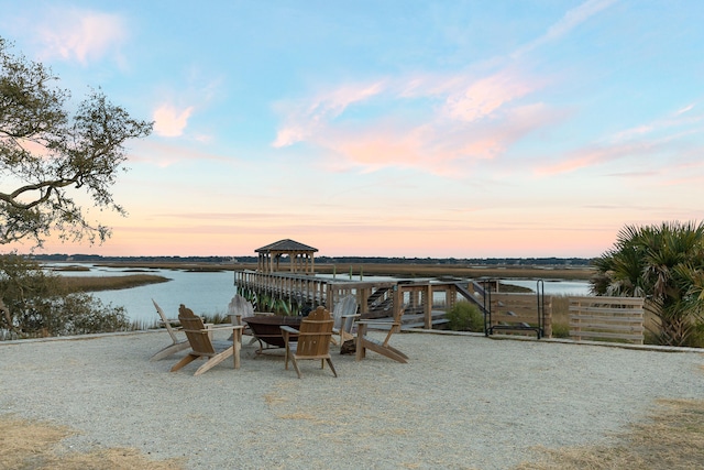 patio terrace at dusk with a water view