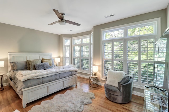 bedroom featuring ceiling fan and light hardwood / wood-style floors