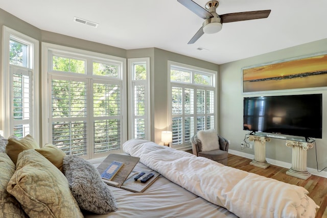 bedroom featuring hardwood / wood-style flooring and ceiling fan