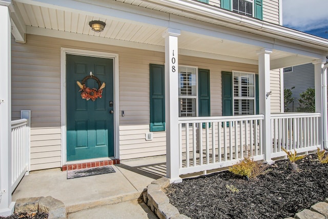 entrance to property with covered porch