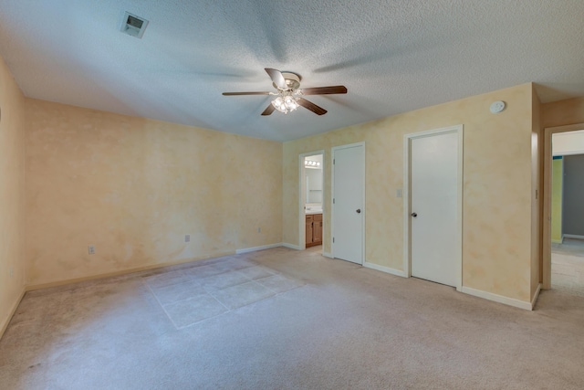 441 Compton Dr, Moncks Corner, SC 29461 - unfurnished bedroom featuring light carpet, a textured ceiling, ensuite bath, baseboards, and ceiling fan