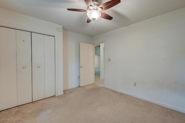 441 Compton Dr, Moncks Corner, SC 29461 - unfurnished bedroom featuring carpet, a closet, baseboards, a textured ceiling, and a ceiling fan