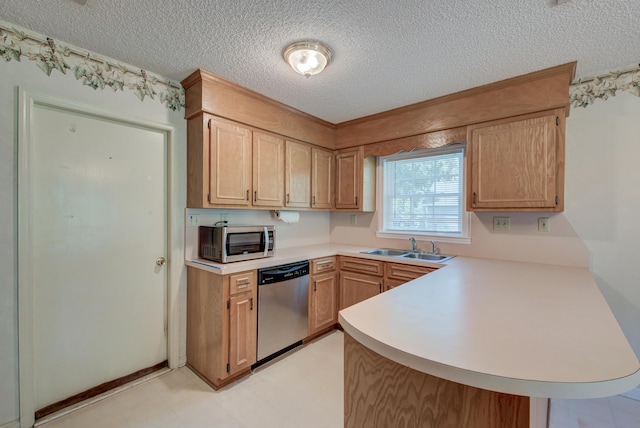 441 Compton Dr, Moncks Corner, SC 29461 - kitchen with appliances with stainless steel finishes, a peninsula, light countertops, a textured ceiling, and a sink