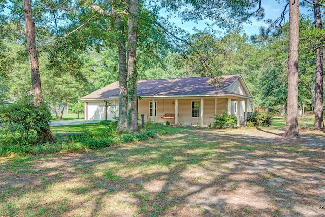 441 Compton Dr, Moncks Corner, SC 29461 - single story home with a porch, a garage, driveway, a front lawn, and roof with shingles
