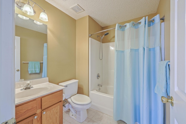 bathroom with visible vents, a textured ceiling, vanity, and toilet