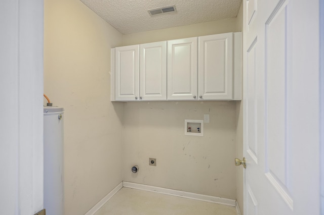 laundry room with electric dryer hookup, washer hookup, a textured ceiling, cabinet space, and baseboards