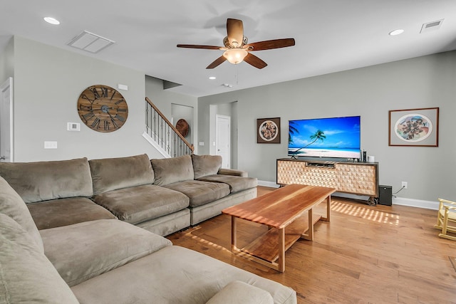 219 Daybreak Blvd, Summerville, SC 29486 - living room with visible vents, baseboards, stairway, light wood-style floors, and a ceiling fan