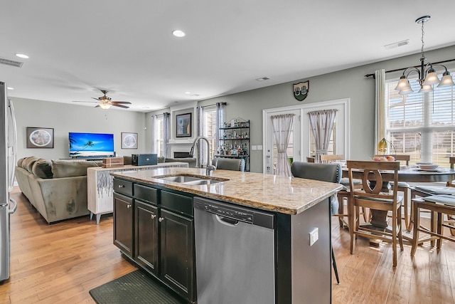 219 Daybreak Blvd, Summerville, SC 29486 - kitchen featuring visible vents, light wood-style flooring, a sink, dishwasher, and open floor plan