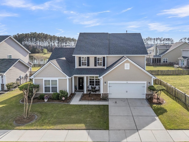 219 Daybreak Blvd, Summerville, SC 29486 - traditional-style home featuring a front lawn, a shingled roof, driveway, and fence