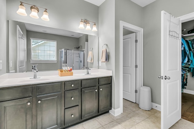 219 Daybreak Blvd, Summerville, SC 29486 - bathroom with tile patterned flooring, double vanity, a stall shower, and a sink