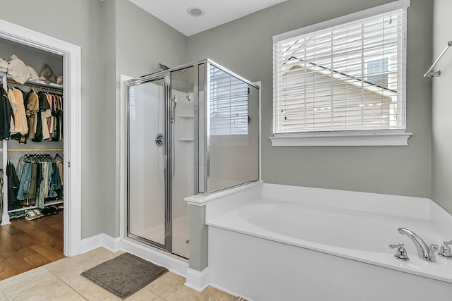219 Daybreak Blvd, Summerville, SC 29486 - full bath featuring tile patterned floors, a stall shower, a spacious closet, and a garden tub