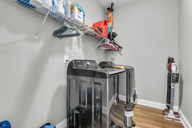 219 Daybreak Blvd, Summerville, SC 29486 - clothes washing area with washing machine and clothes dryer, laundry area, baseboards, and wood finished floors