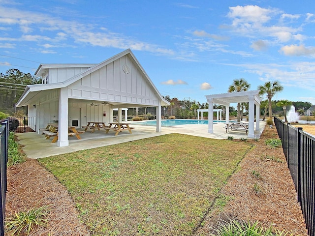 219 Daybreak Blvd, Summerville, SC 29486 - view of yard with a ceiling fan, a pergola, a patio, fence, and a community pool