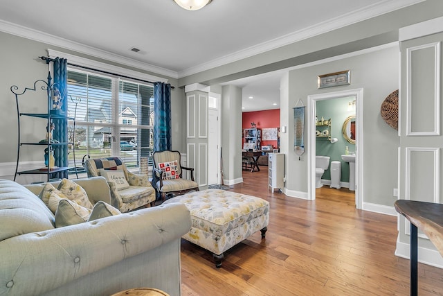 219 Daybreak Blvd, Summerville, SC 29486 - living area with visible vents, crown molding, baseboards, and wood finished floors