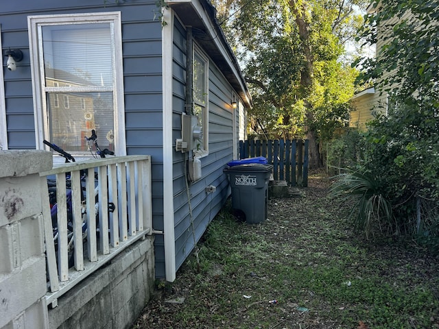 view of home's exterior with fence