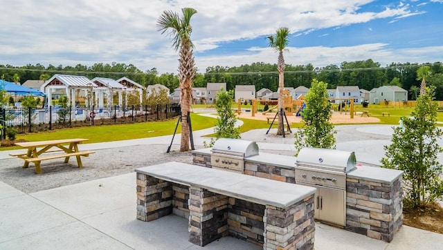 323 Bear Paw Ln, Summerville, SC 29486 - view of patio / terrace with area for grilling, an outdoor kitchen, and a residential view