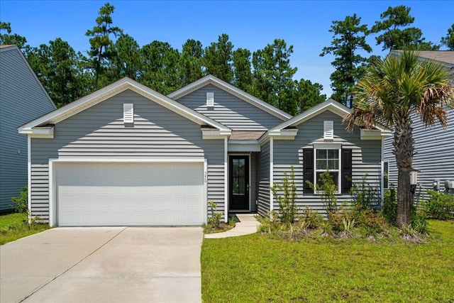 view of front of home with a garage and a front yard