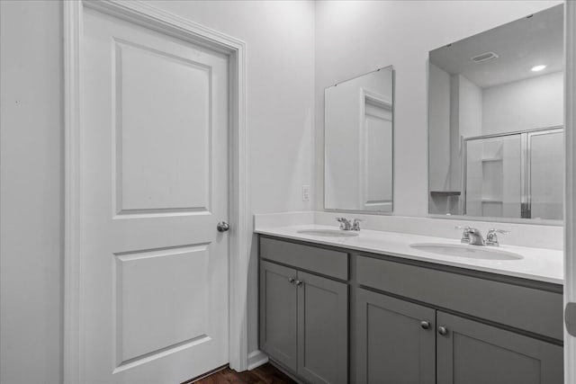 bathroom with vanity and an enclosed shower