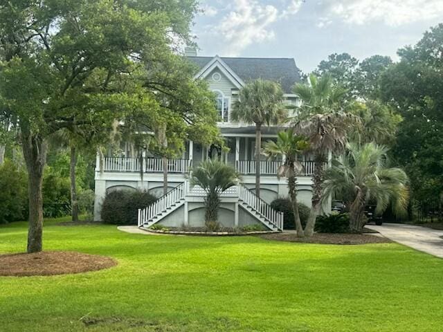 1447 Headquarters Plantation Dr, Johns Island, SC 29455 - view of building exterior featuring stairway and concrete driveway