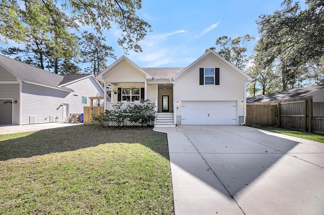 view of front of house with covered porch, a front yard, and a garage